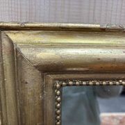 Miroir doré de style Louis XVI