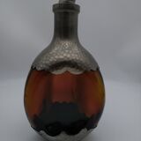 Vintage decanter in glass and tin.