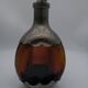 Vintage decanter in glass and tin.