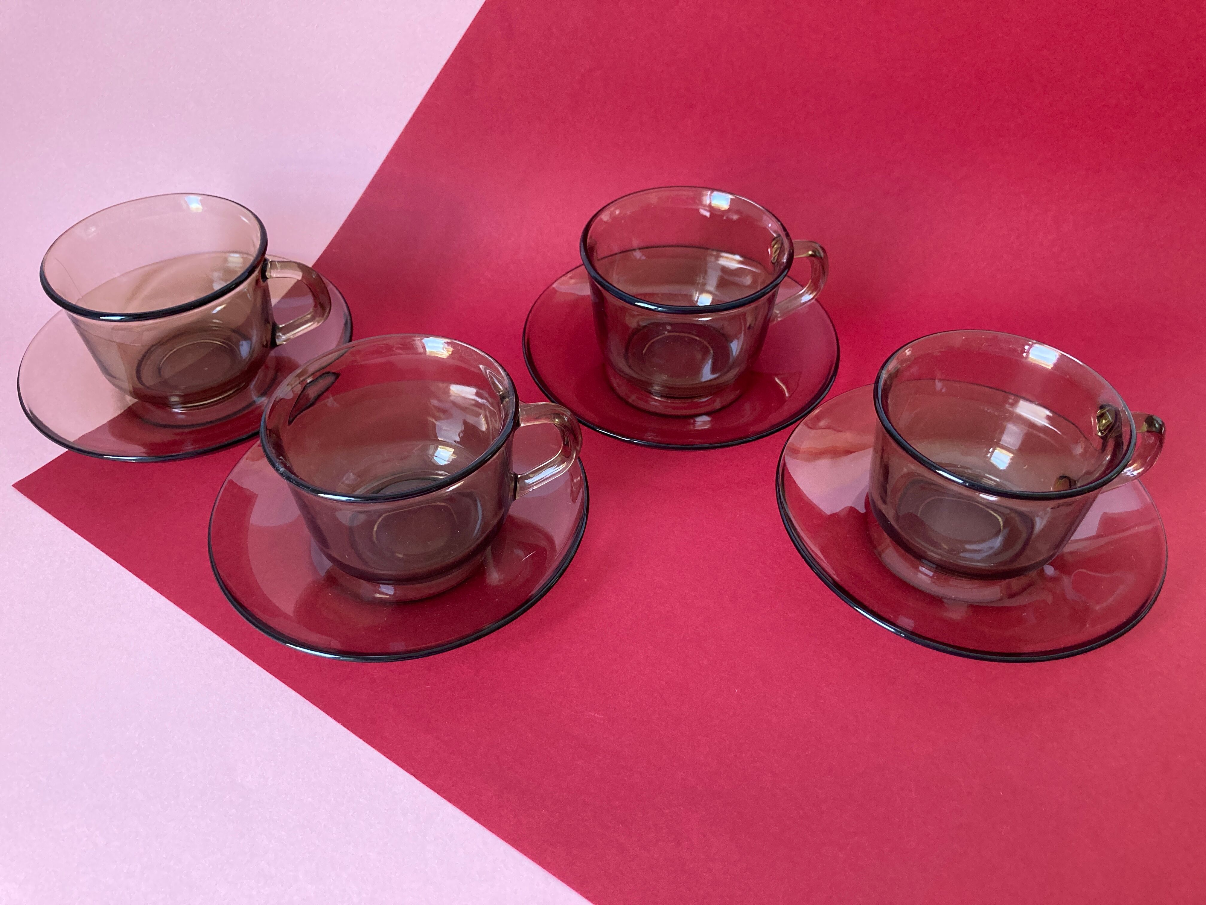 4 Arcoroc coffee cups and saucers in black transparent glass