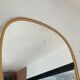 Free-form asymmetrical mirror from the 60s and 70s