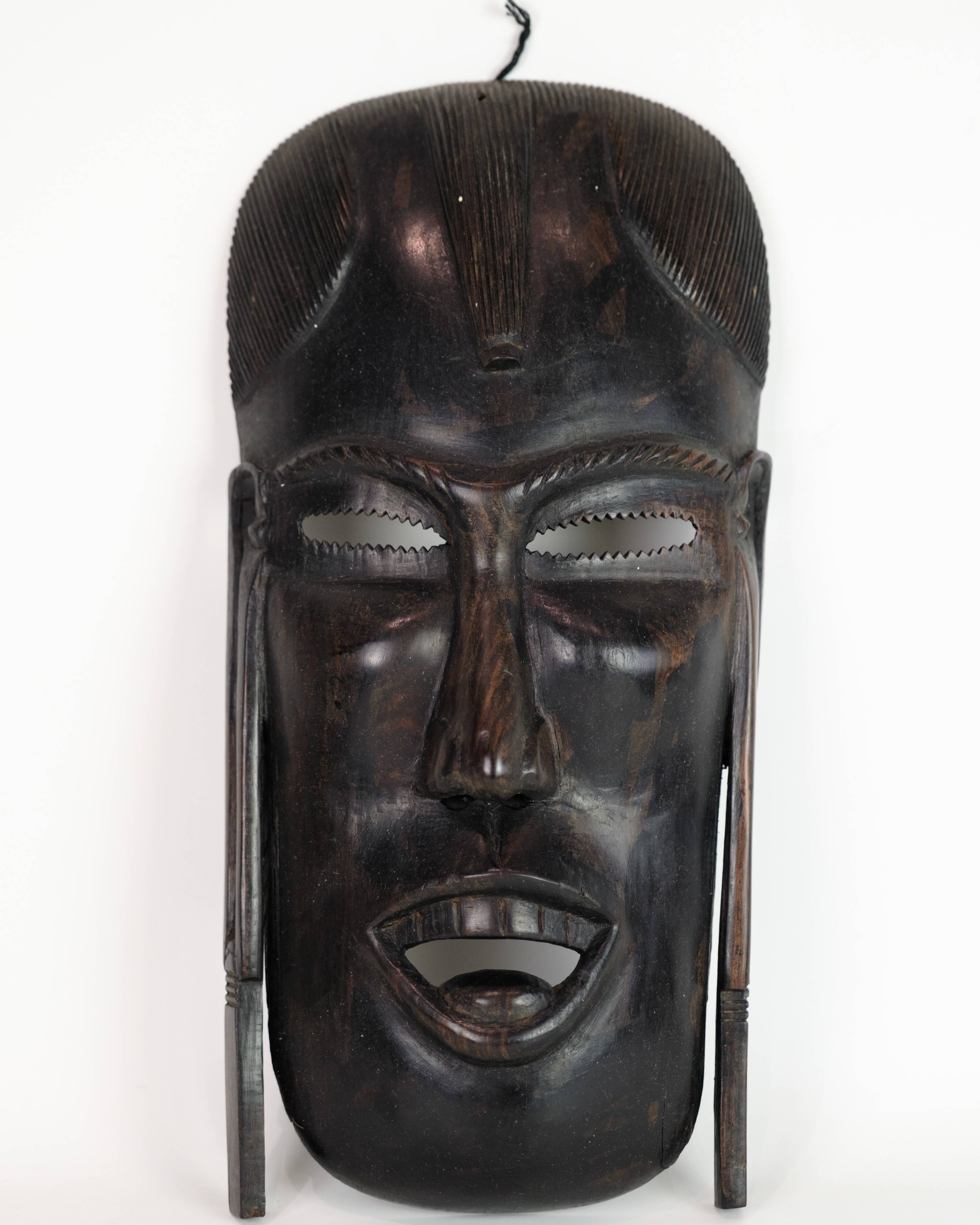 African Mask Hand Craved In Dark Wood From West Africa