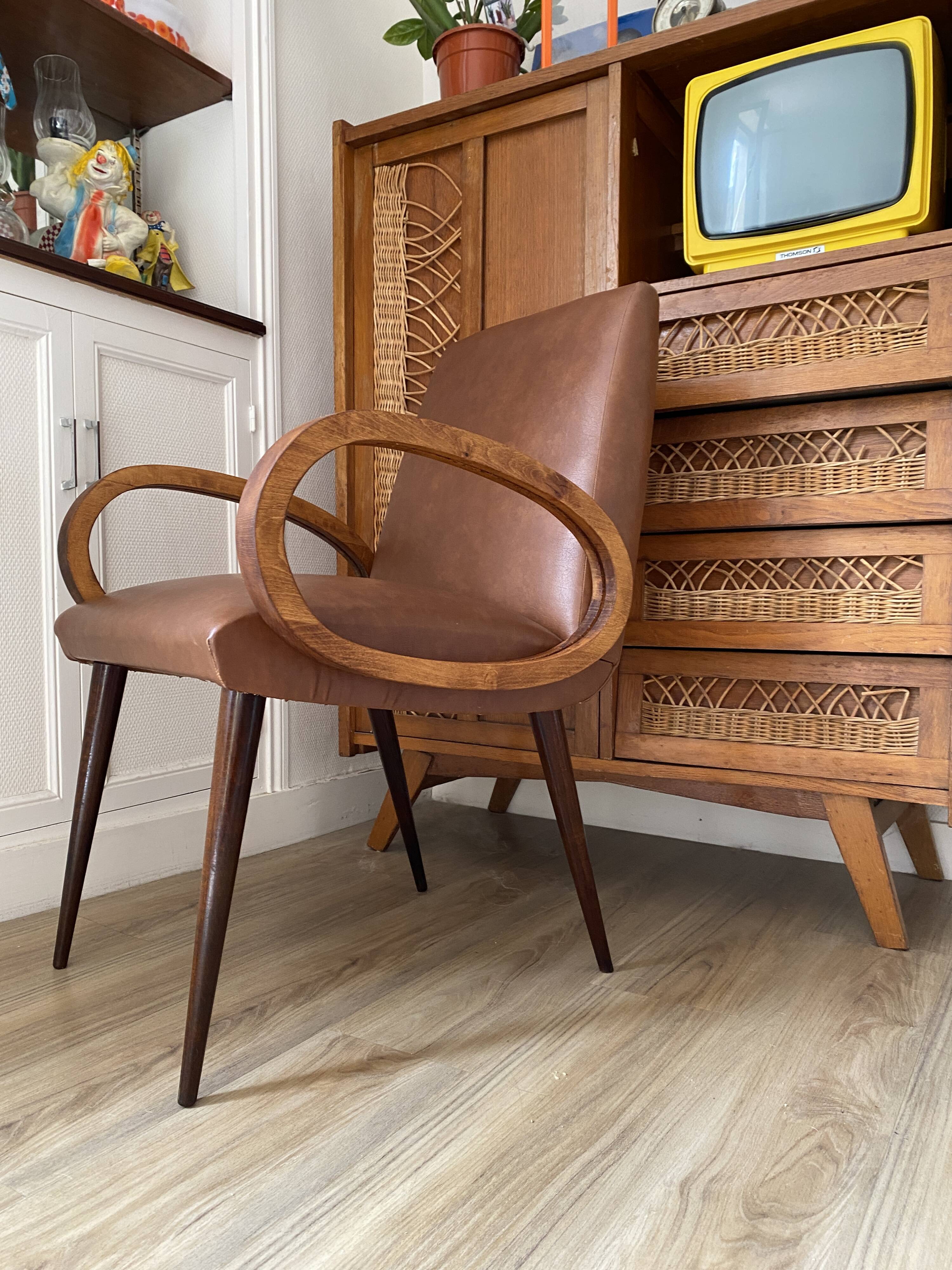 Mid-Century Scandinavian vintage retro armchair with oval armrests.