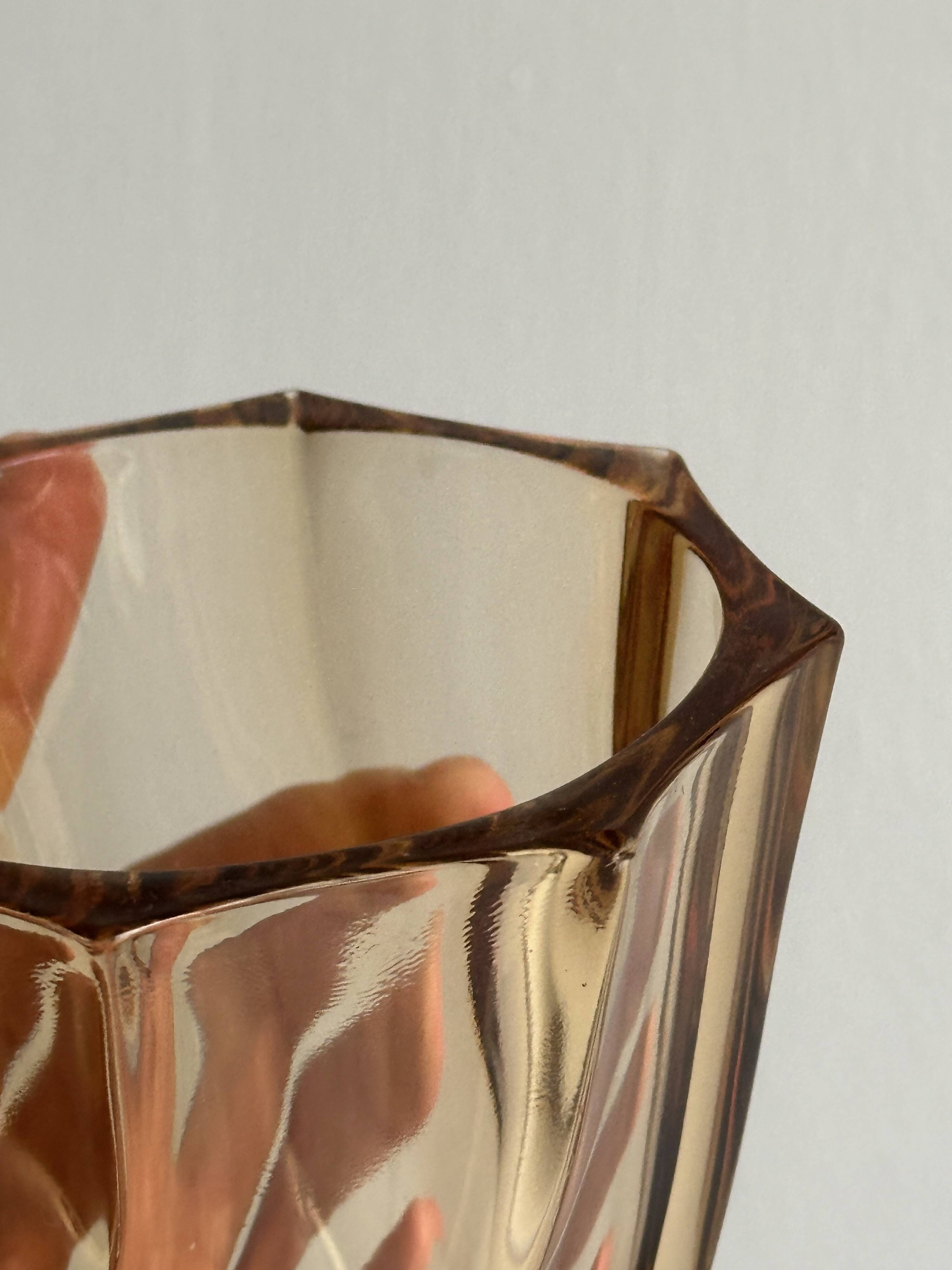 Small translucent pink twisted glass vase