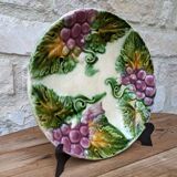 Old barbotine plate with vine motif