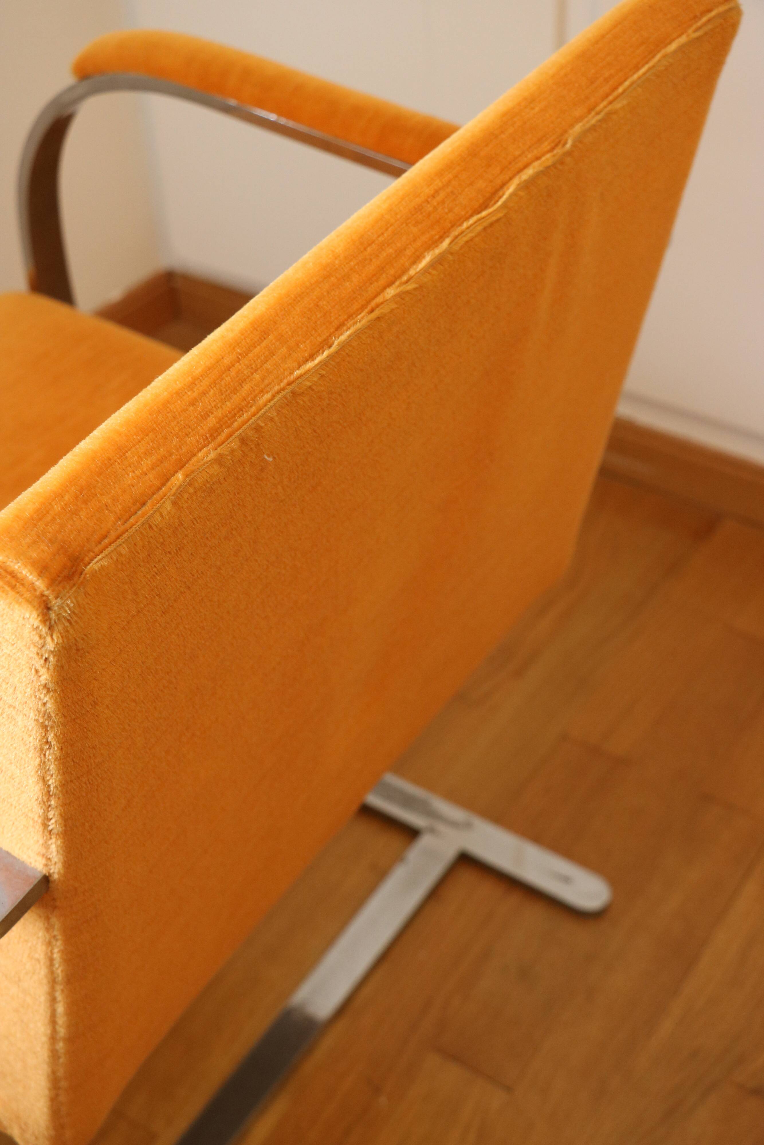 Chrome-plated metal and orange fabric armchair, 1970