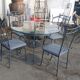 Table ronde et 4 chaises en fer forgé