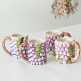 4 old mugs in Bassano slip signed