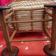 Vintage wicker cradle on wheels from the 1970s.