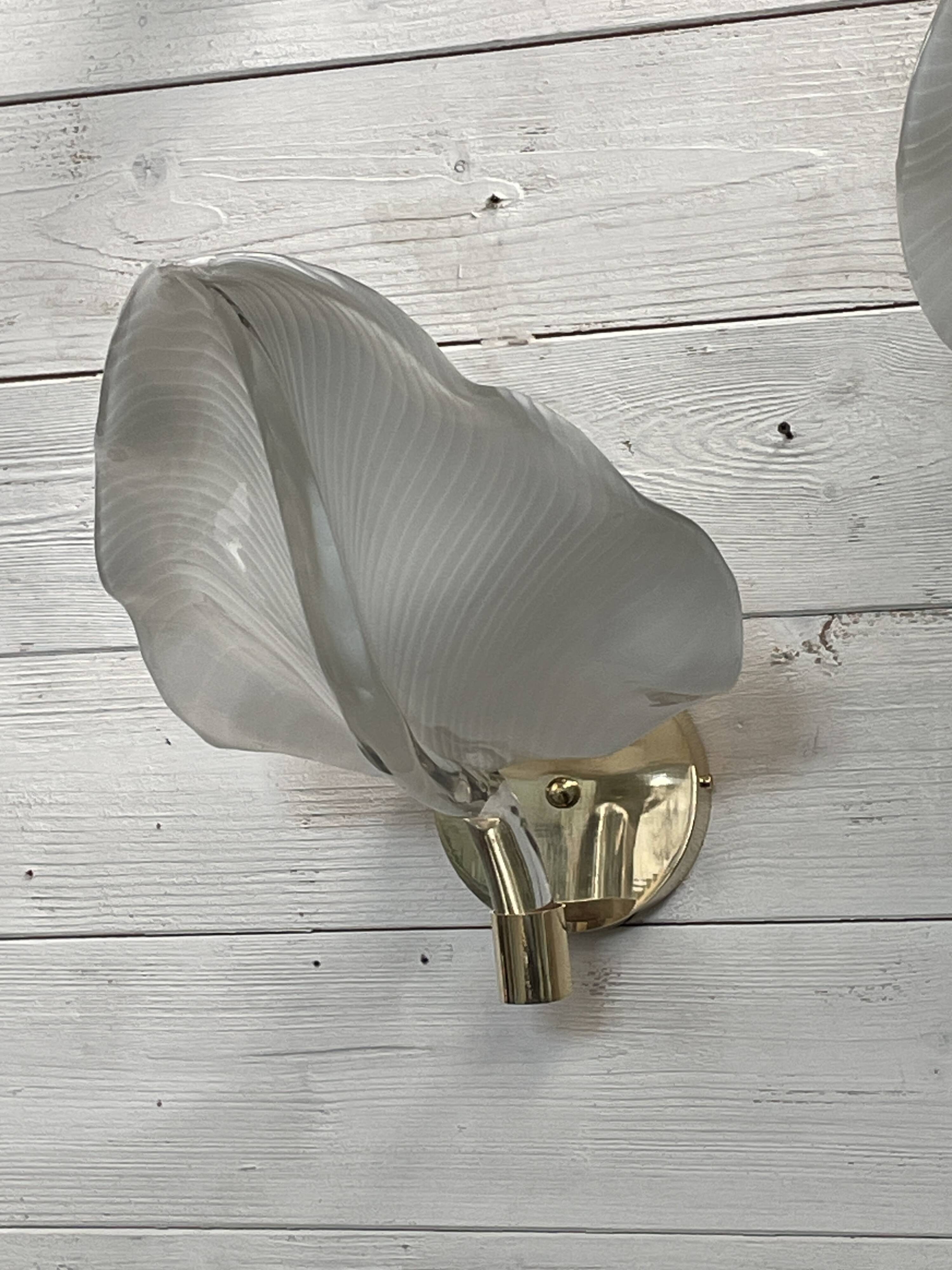 Set of 3 Murano glass wall lamps in white and brass, 1970s.