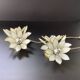 Pair of Hollywood Regency flower sconces in white glass and brass. Italy