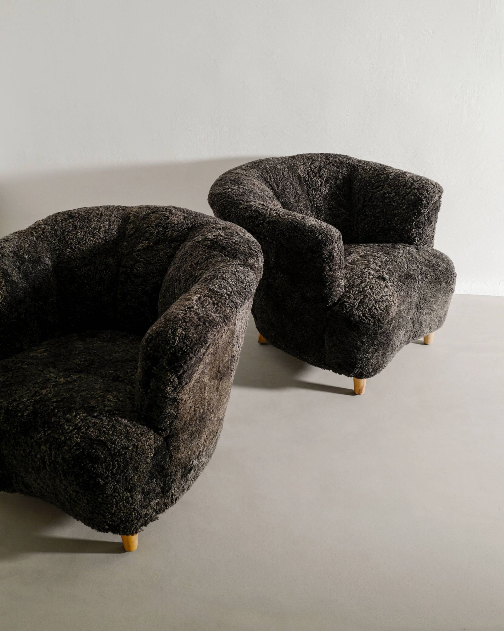 Pair of Swedish Curved Mid Century Modern Armchairs in Dark Sheepskin 1940s