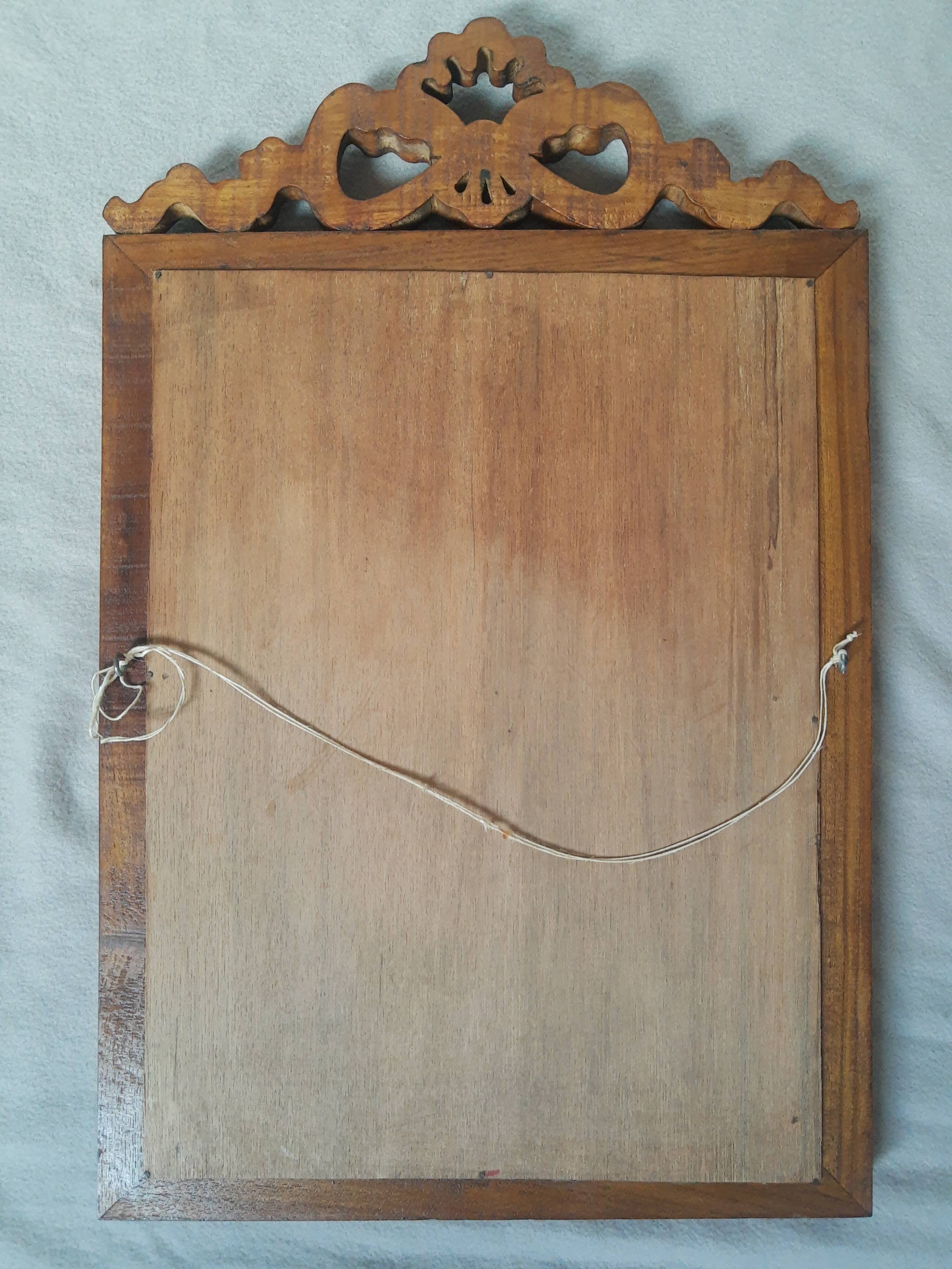 Wooden hanging mirror with vintage carved knot