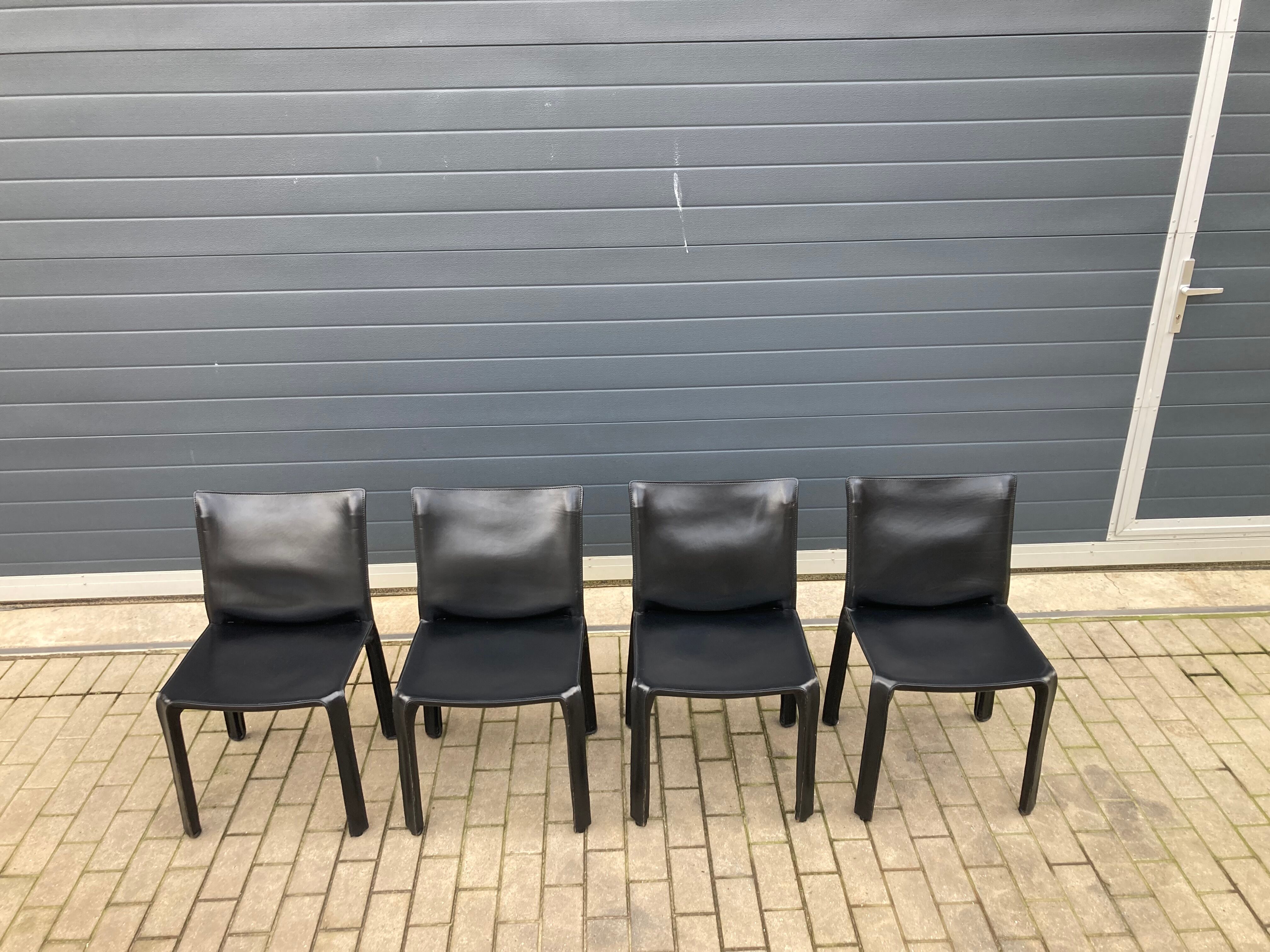 4 black Cassina Cab chairs by Mario Bellini