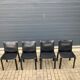 4 black Cassina Cab chairs by Mario Bellini