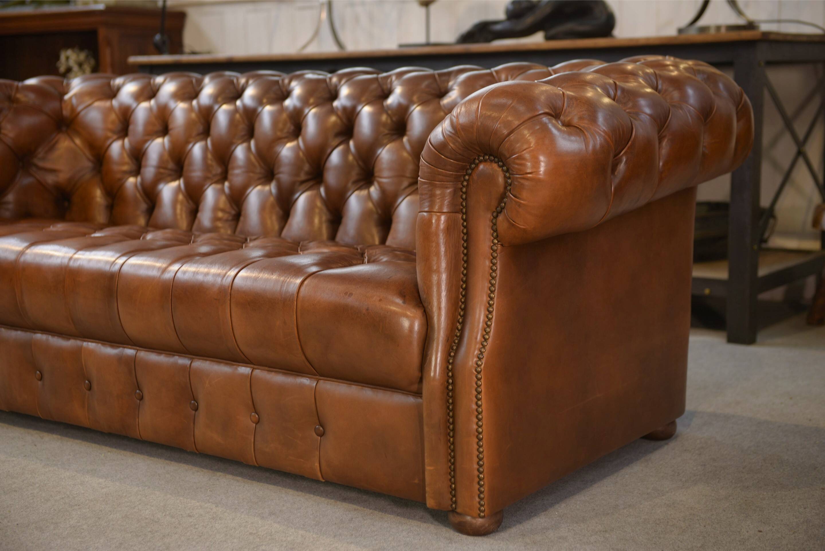 Tan leather tufted Chesterfield sofa