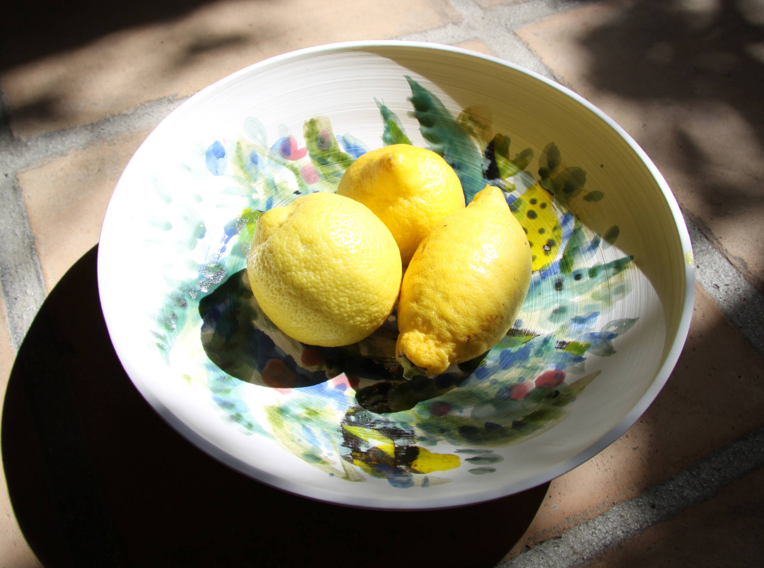 Decorated white earthenware fruit bowl