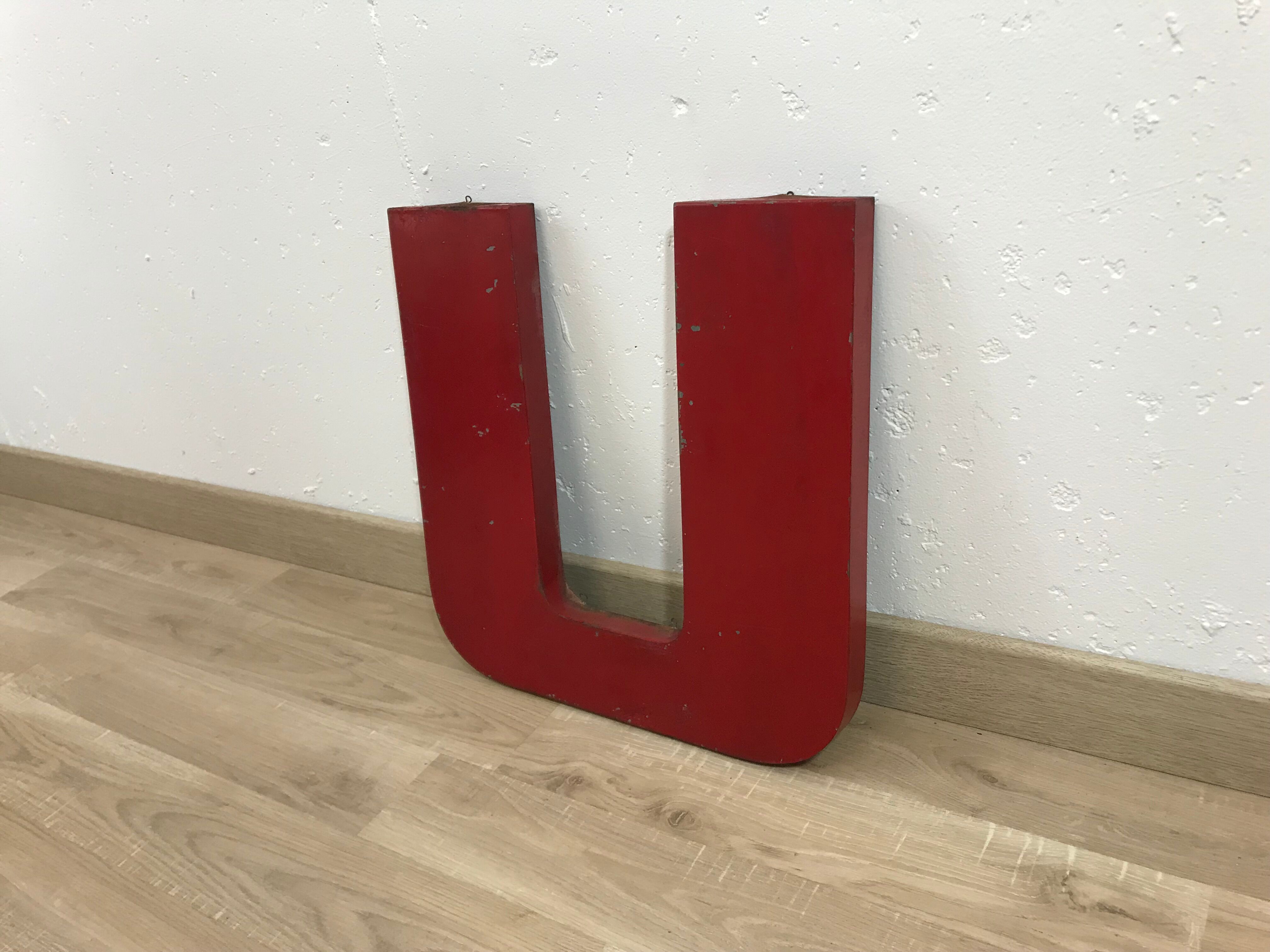 Old metal letter "U"