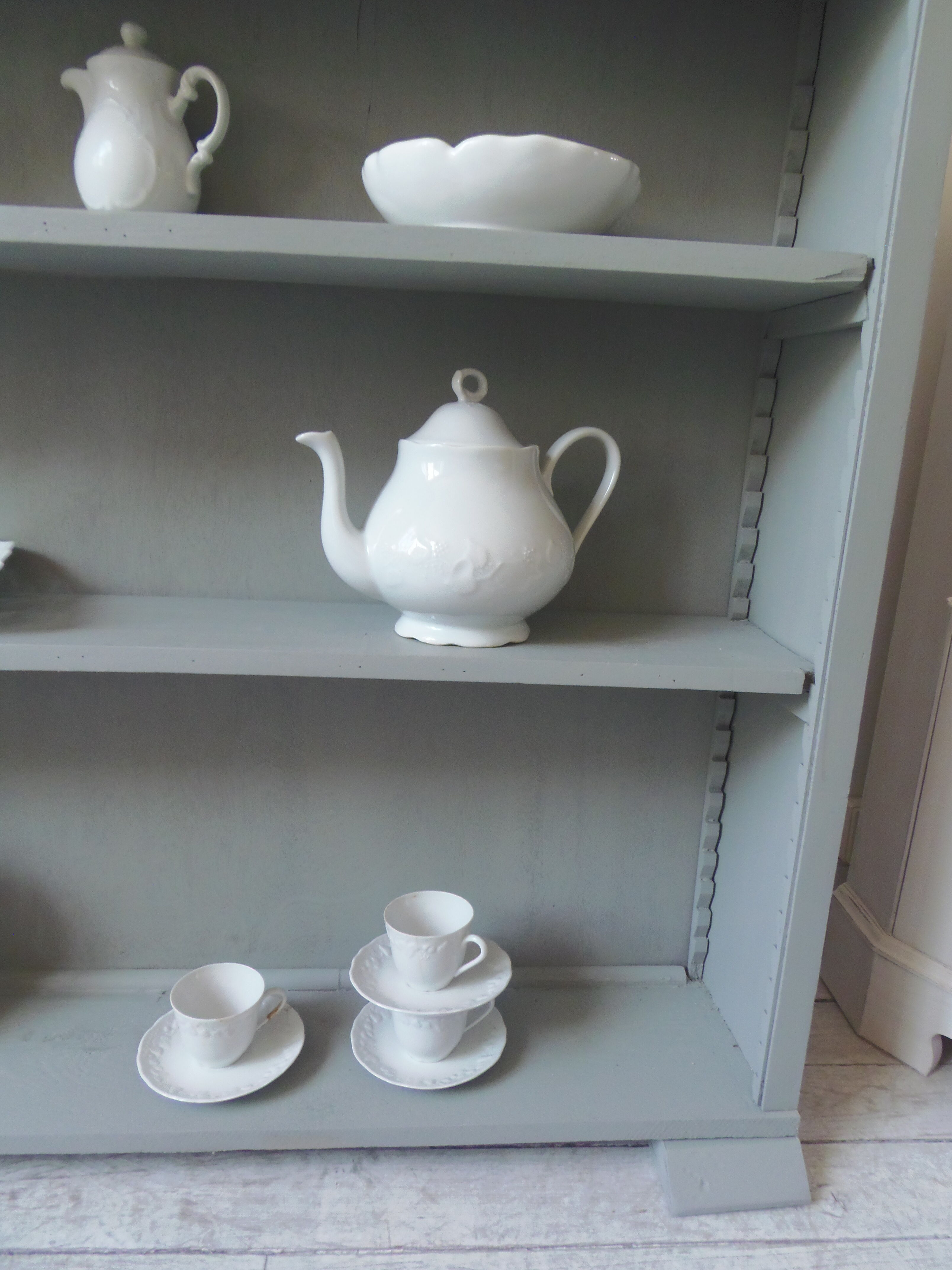 Vintage shallow bookcase, re-enchanted in gray green, wooden tray.