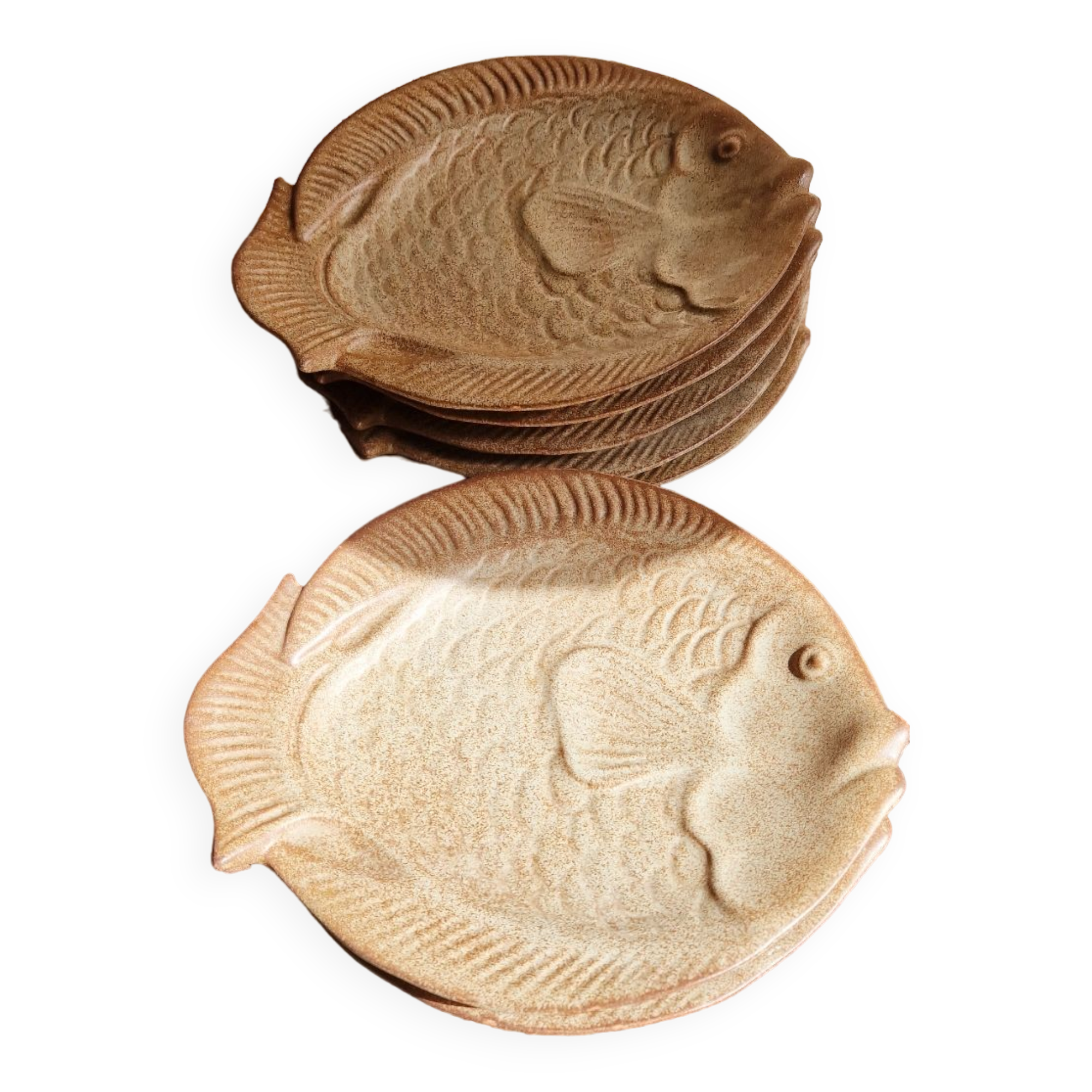 Deep plates in the shape of fish in stoneware
