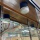 Store window with sliding doors in matte black patinated oak - 30s