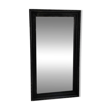 1950s mirror, matte black wood with a patina.