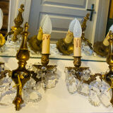 Pair of gilt bronze wall sconces with pendants from the mid-20th century.