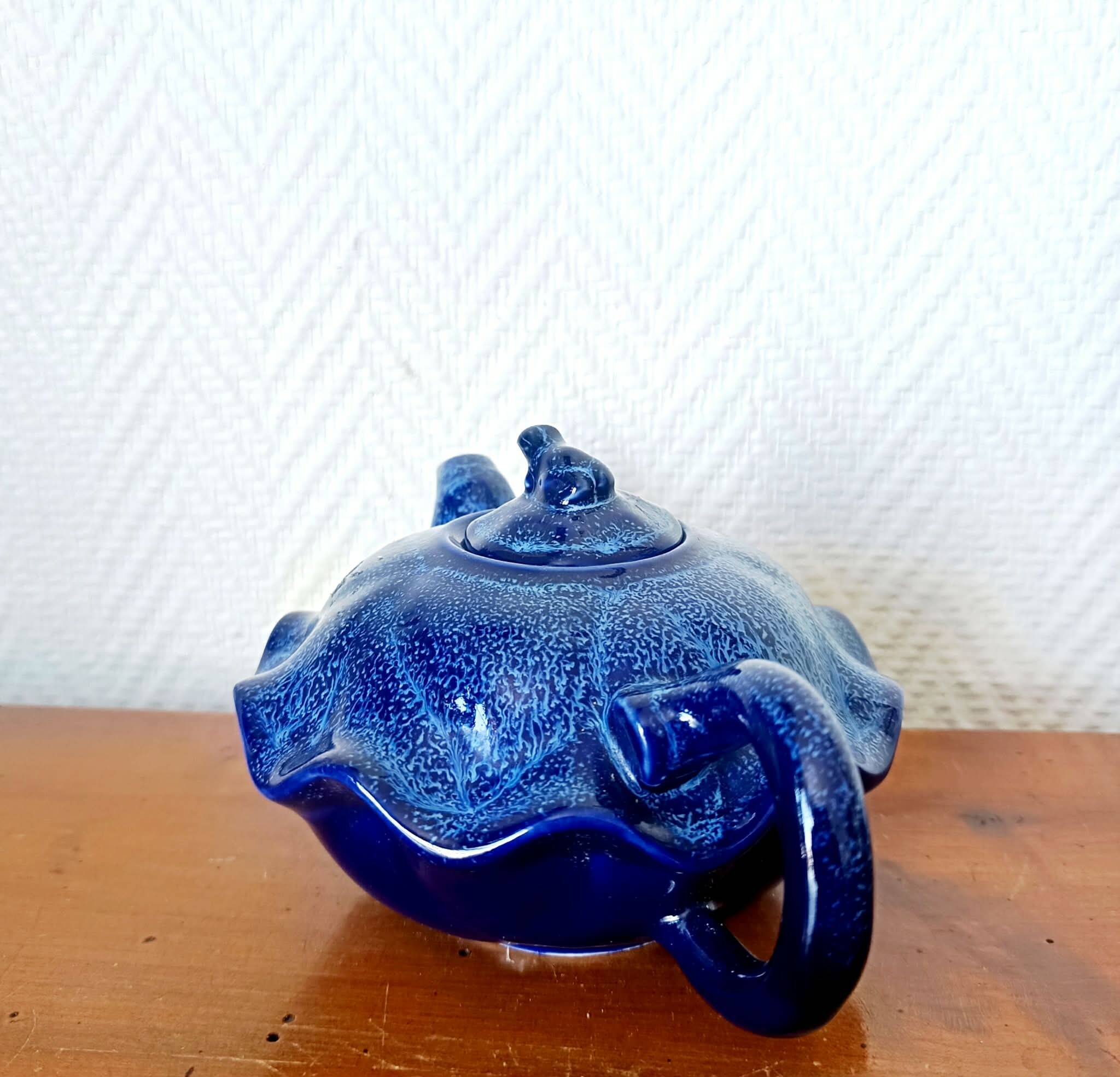Blue ceramic Art Deco teapot with a frog.