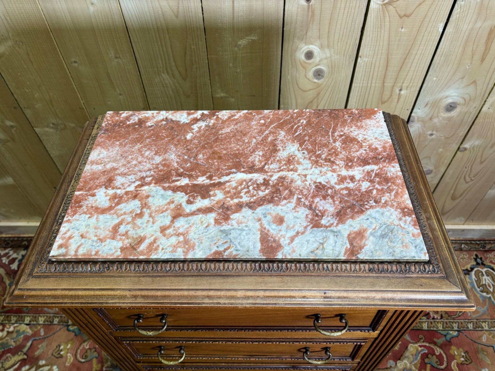 Louis XVI style molded and carved walnut chest of drawers