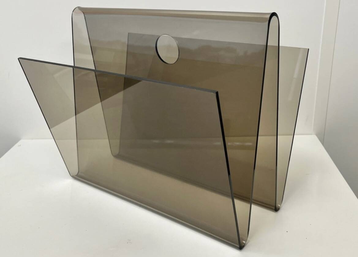 Smoked plexiglass magazine rack in the style of Michel Dumas, France, 1970s.