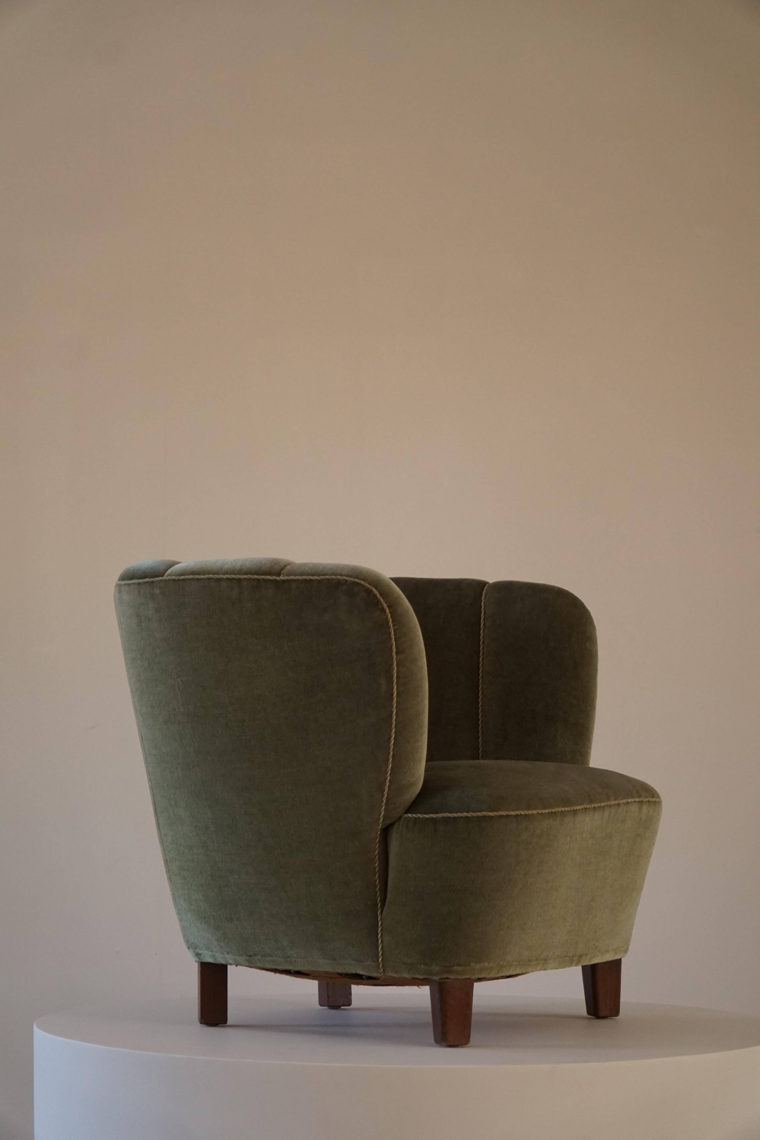 Curved Danish club chair from the mid-century, in the style of Viggo Boesen, 1940s.