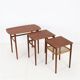 Rare set of three teak nesting tables with cane magazine rack / side tables / mid-century Danish modern design / 1950s / 1960s