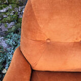Orange velvet armchair