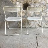 Pair of white perforated metal folding chairs - vintage