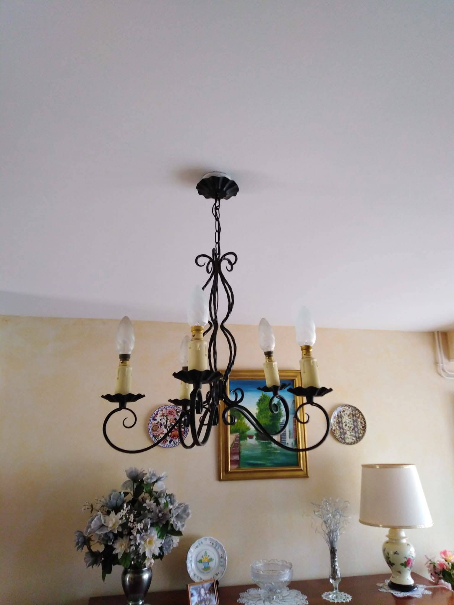 Antique wrought iron chandelier with 5 branches.