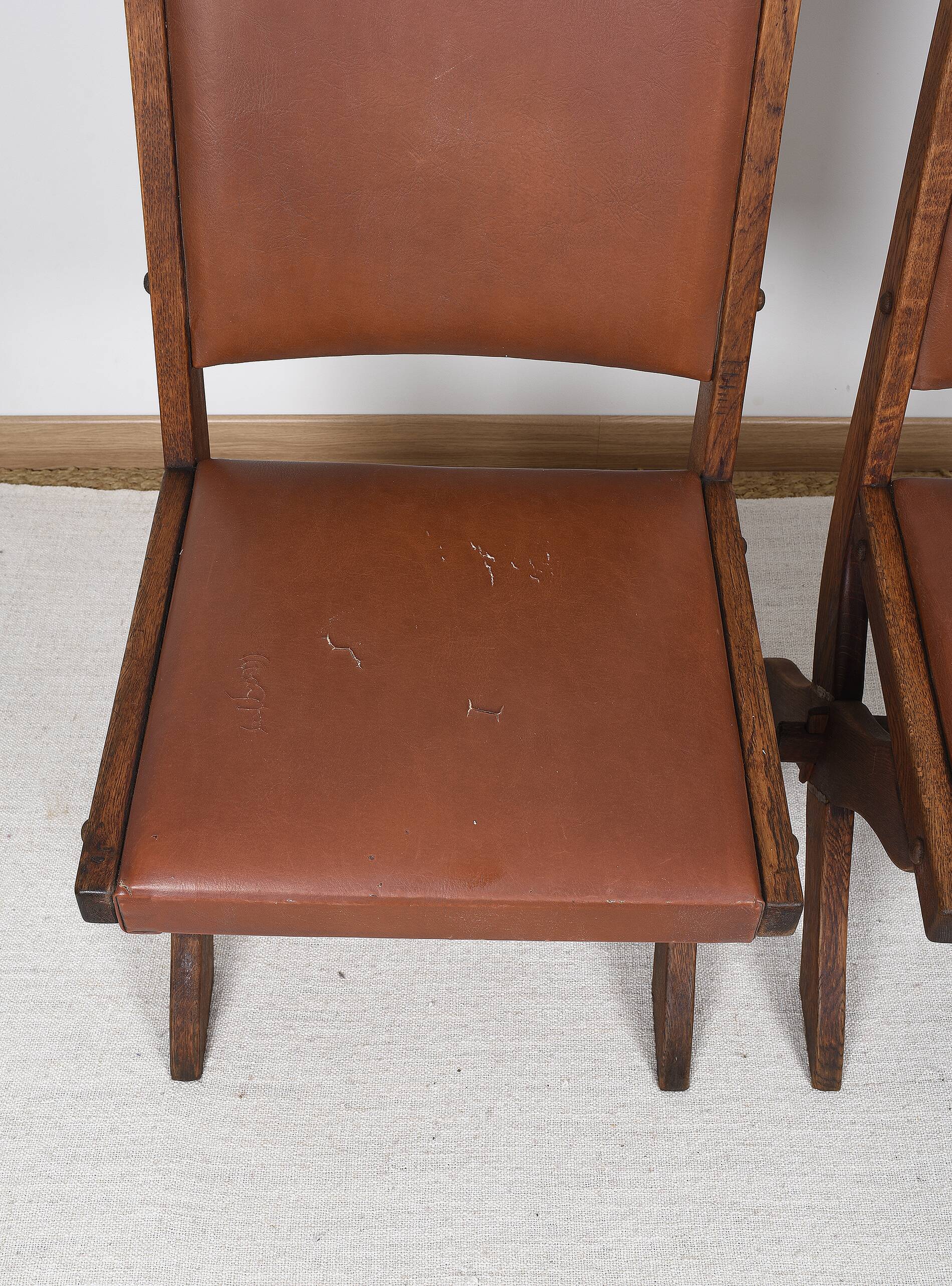 Pair of brutalist style chairs, in wood and leather.