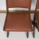 Pair of brutalist style chairs, in wood and leather.