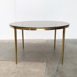 Mid-century Hollywood Regency style coffee table in brass and glass, made in Germany by Vereinigte Werkstätten, 1960s.