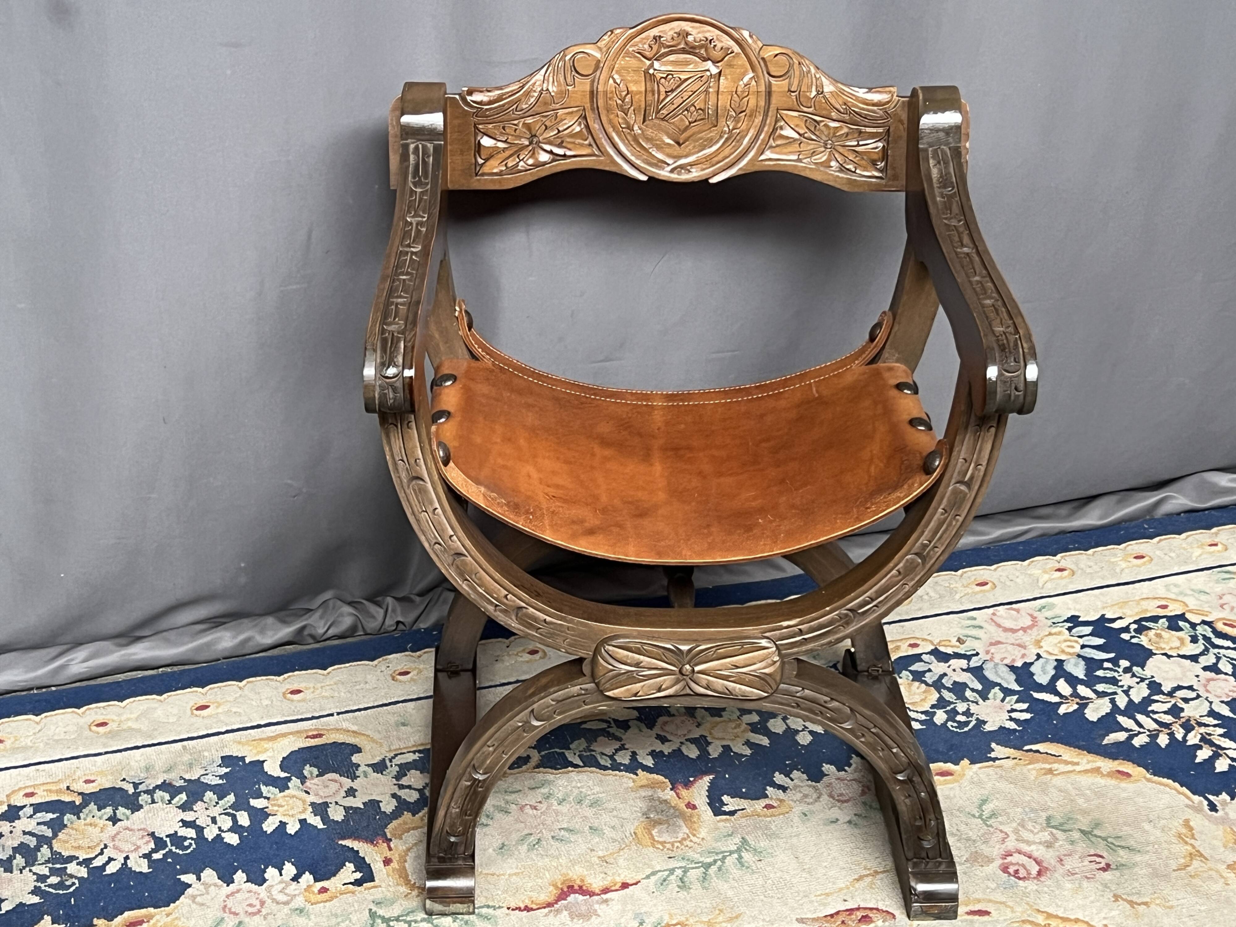 Dagobert style armchair. Solid walnut, leather.