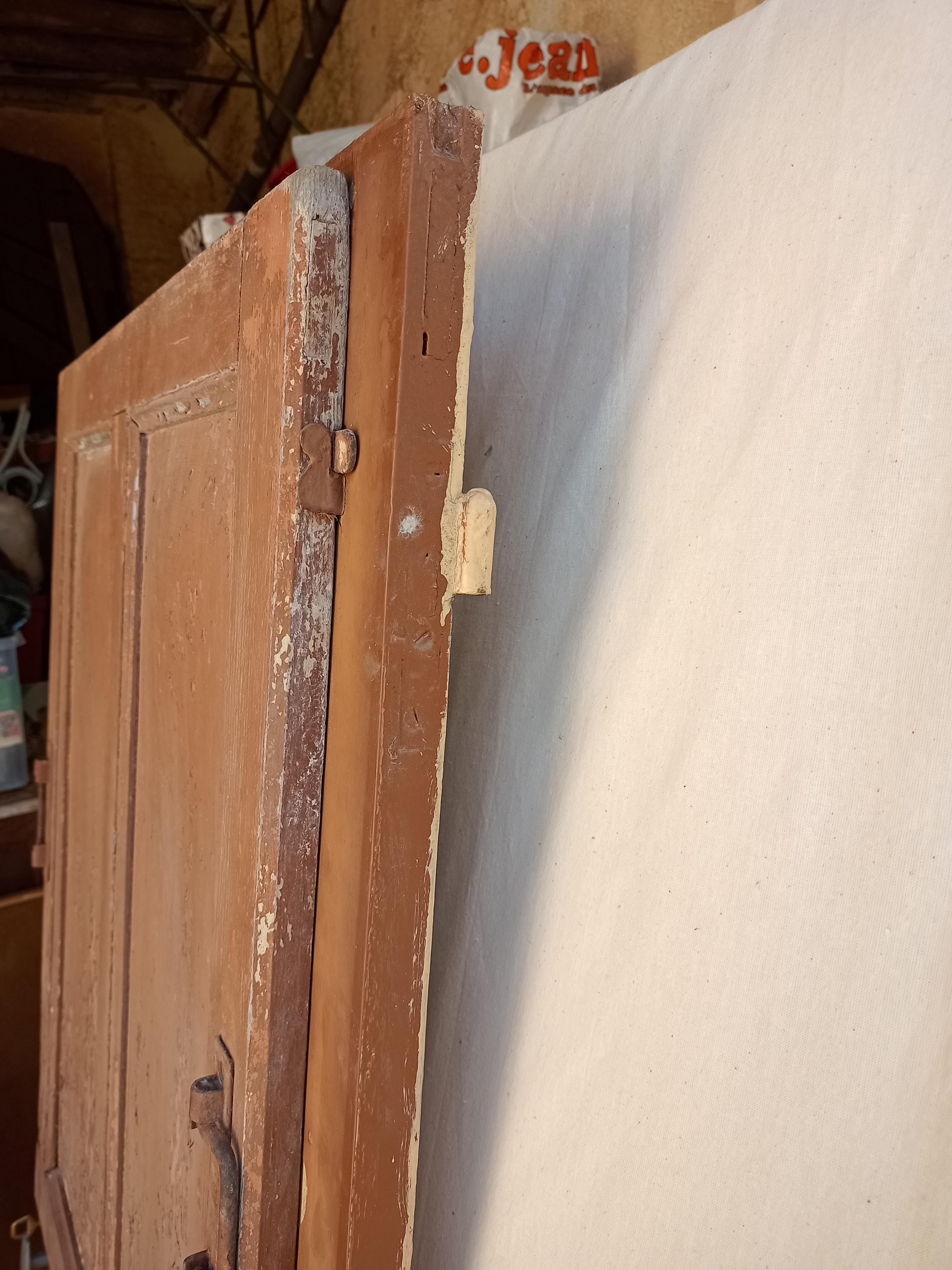 Old glazed door with its shutter