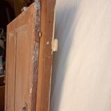 Old glazed door with its shutter