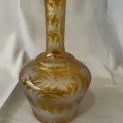 Amber bohemian glass liqueur carafe decorated with a stag in the forest.