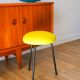 Black iron tripod stool with boiled wool, yellow, 1960.