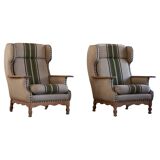 Pair of high-back lounge chairs in modern Danish style in the manner of Henning Kjærnulf, 1960s.