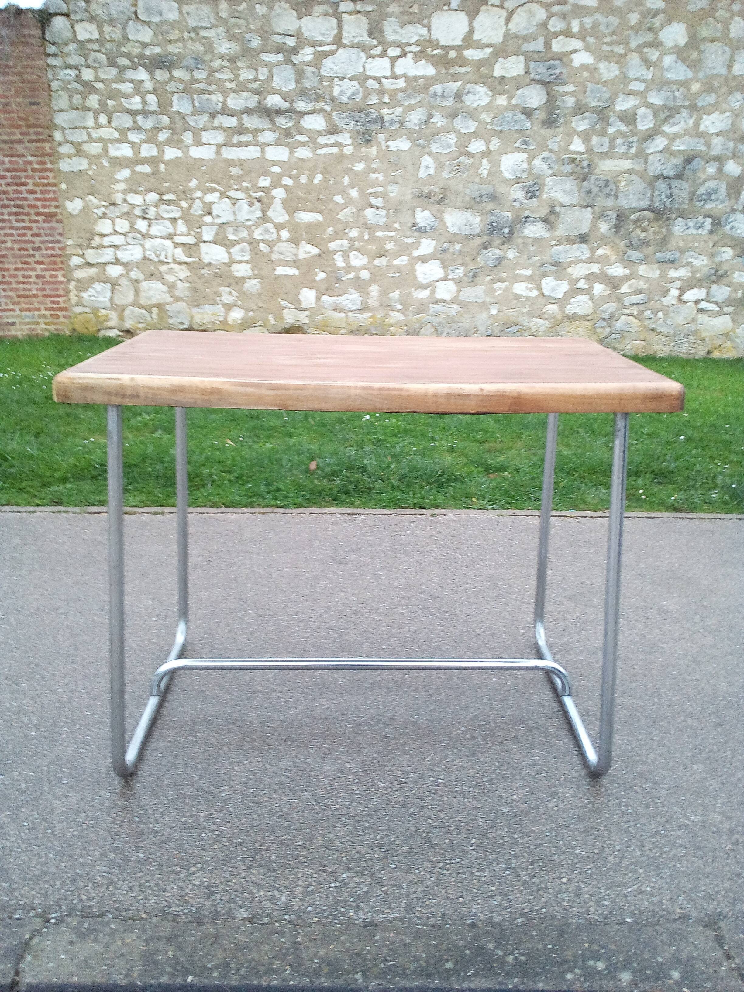 Old table in chrome steel and wood