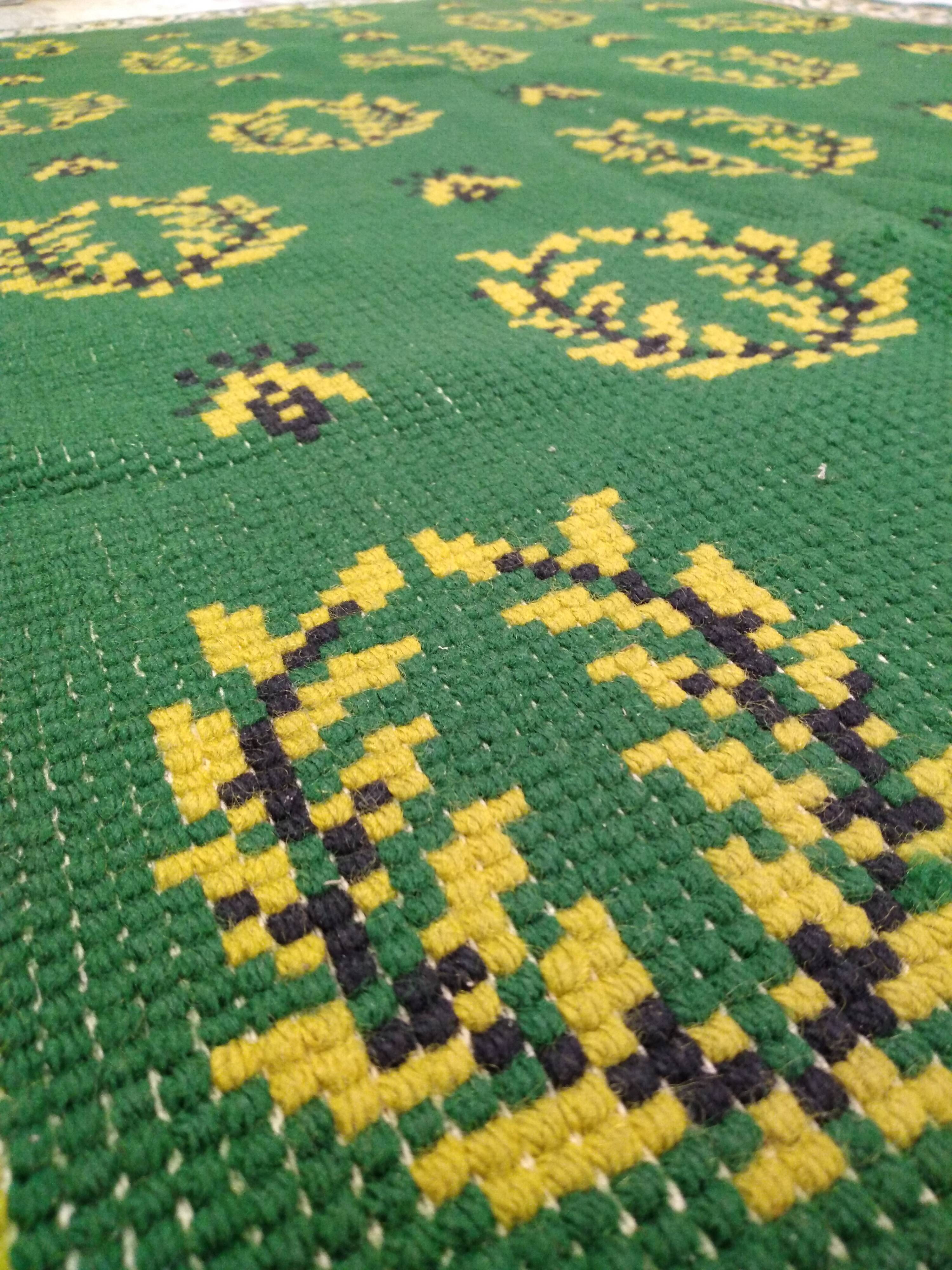 Antique green Berber rug