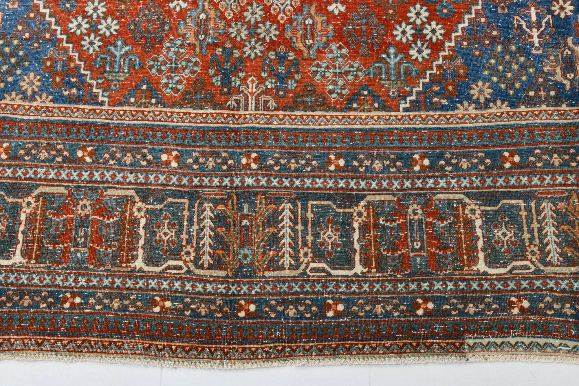 Vintage Turkish rug in brick red and indigo with floral design, 276 × 389 cm
