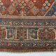 Vintage Turkish rug in brick red and indigo with floral design, 276 × 389 cm