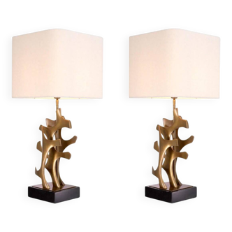 Pair of table lamps in patinated brass and black granite base.