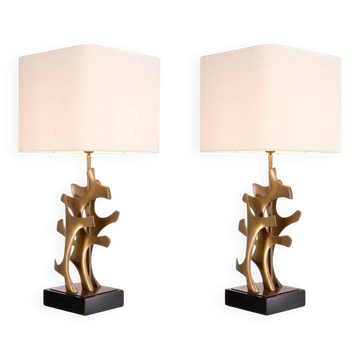 Pair of table lamps in patinated brass and black granite base.